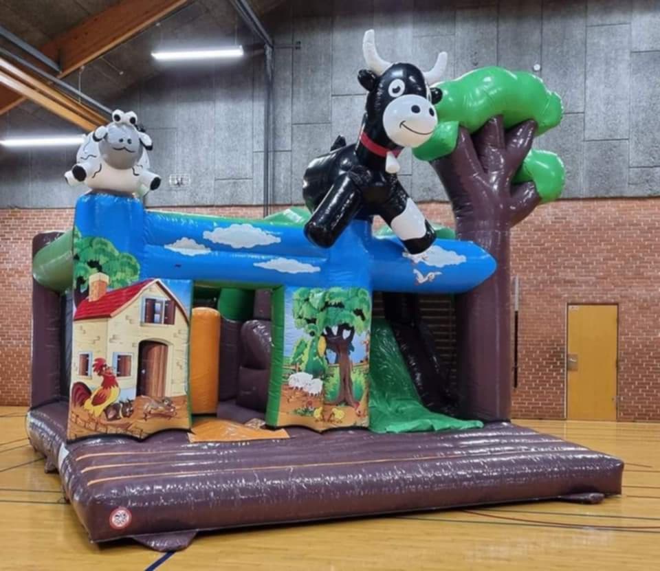 Eight shirts arranged on table in black, olive, grey, blue, white, red, mustard, and green.