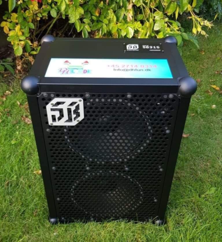 Eight shirts arranged on table in black, olive, grey, blue, white, red, mustard, and green.