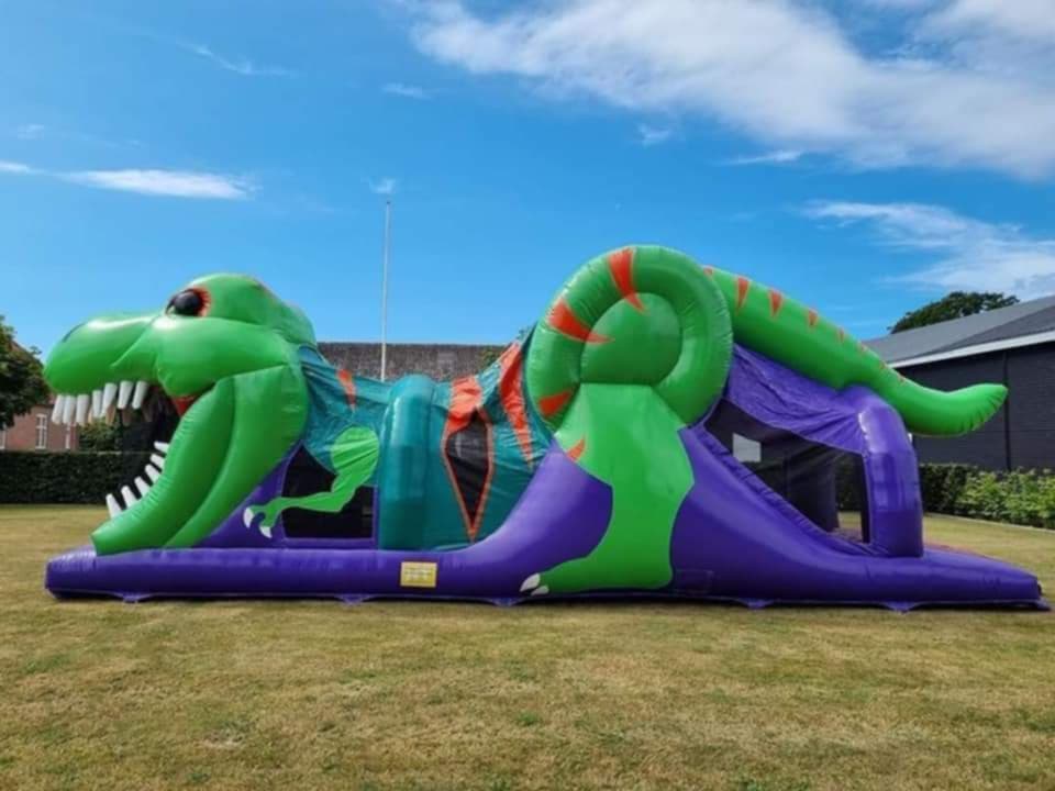 Eight shirts arranged on table in black, olive, grey, blue, white, red, mustard, and green.