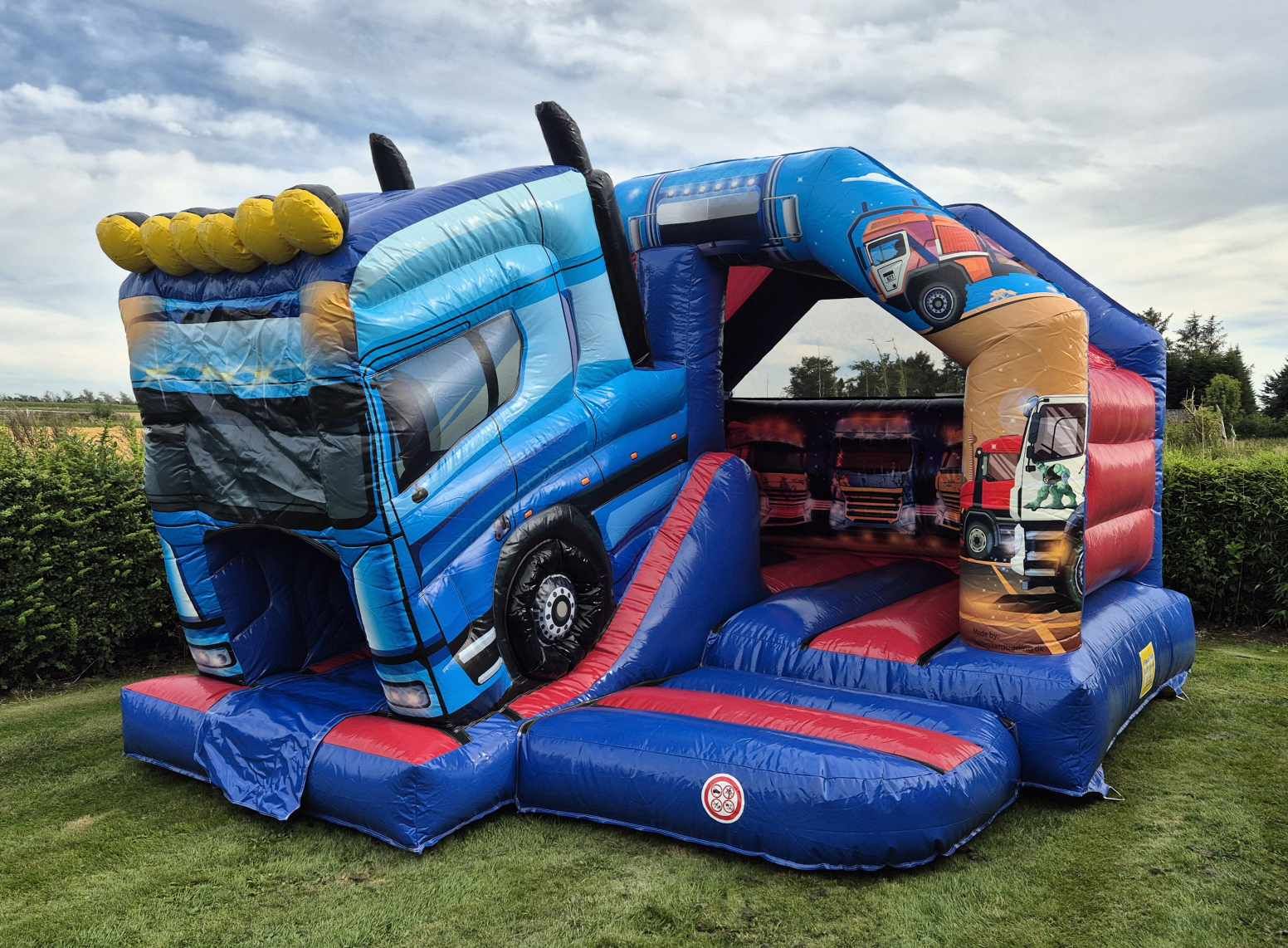 Eight shirts arranged on table in black, olive, grey, blue, white, red, mustard, and green.