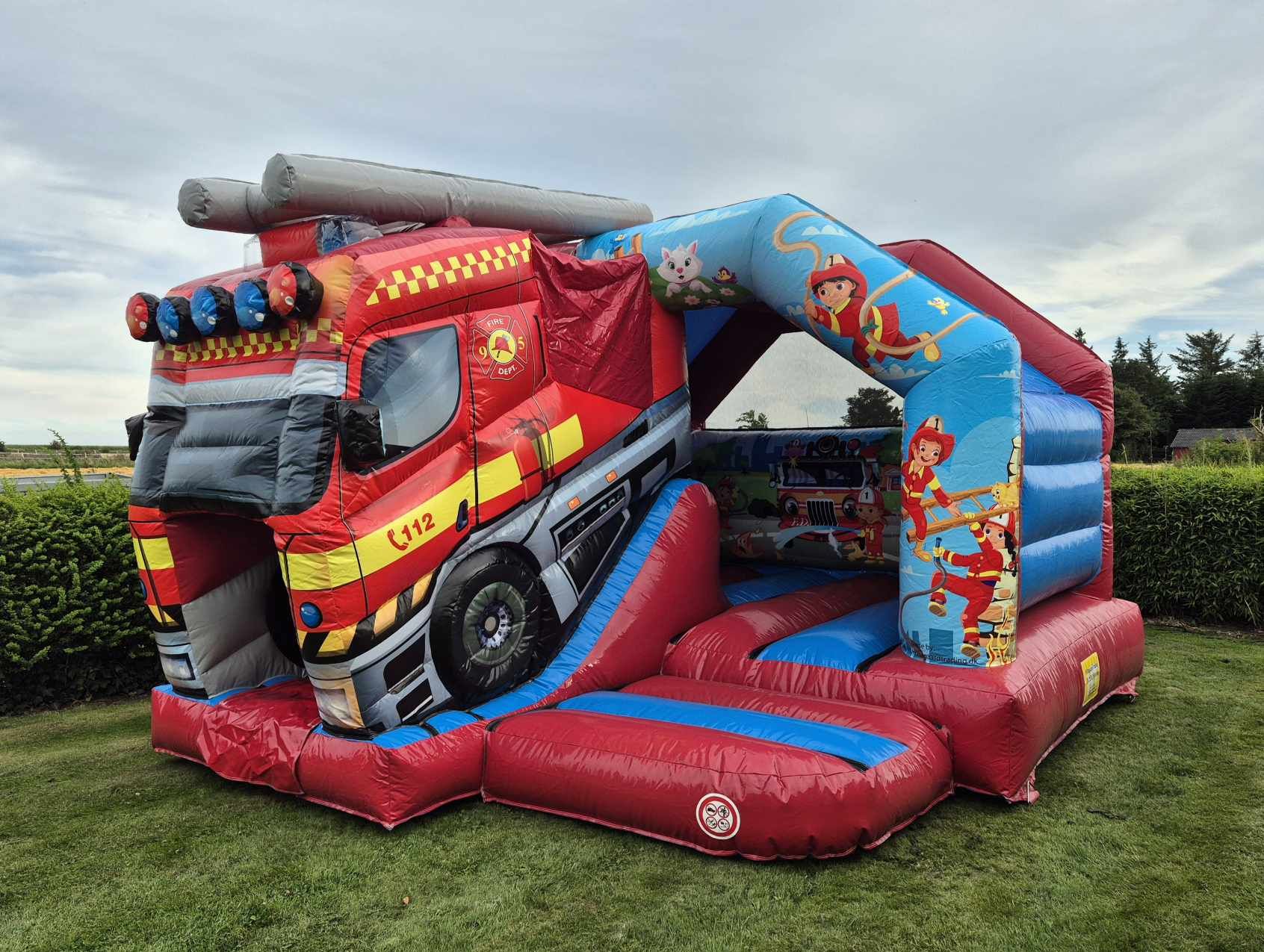 Eight shirts arranged on table in black, olive, grey, blue, white, red, mustard, and green.