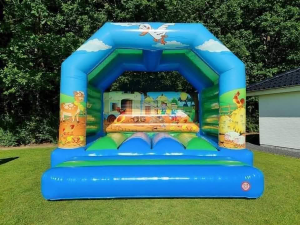 Eight shirts arranged on table in black, olive, grey, blue, white, red, mustard, and green.