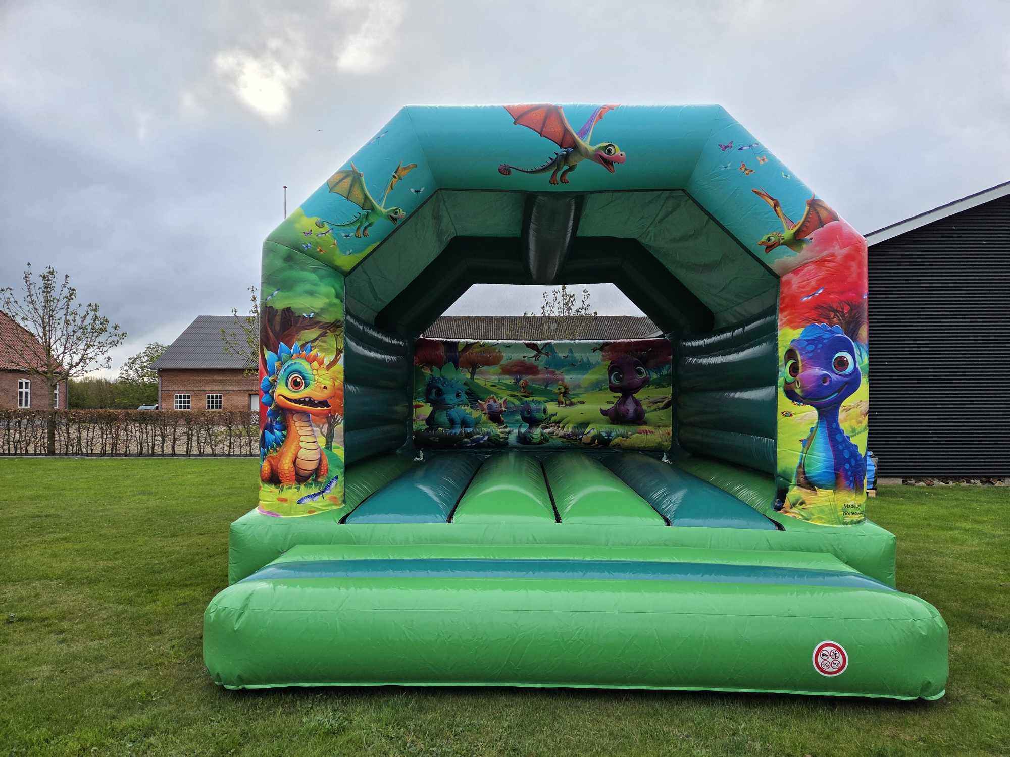 Eight shirts arranged on table in black, olive, grey, blue, white, red, mustard, and green.
