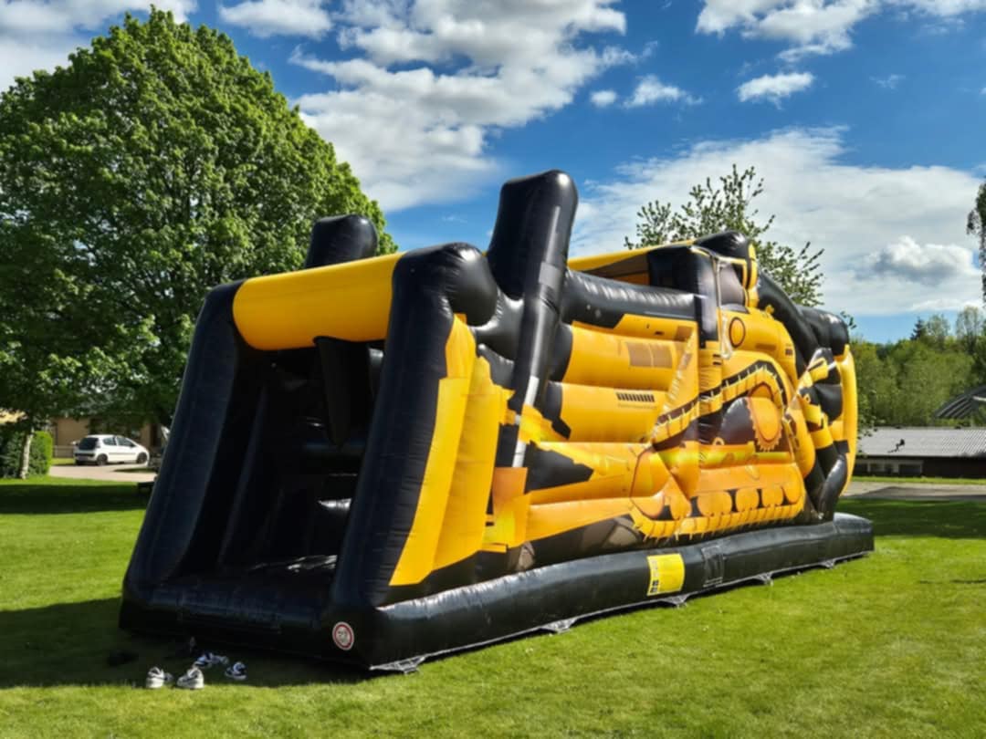 Eight shirts arranged on table in black, olive, grey, blue, white, red, mustard, and green.