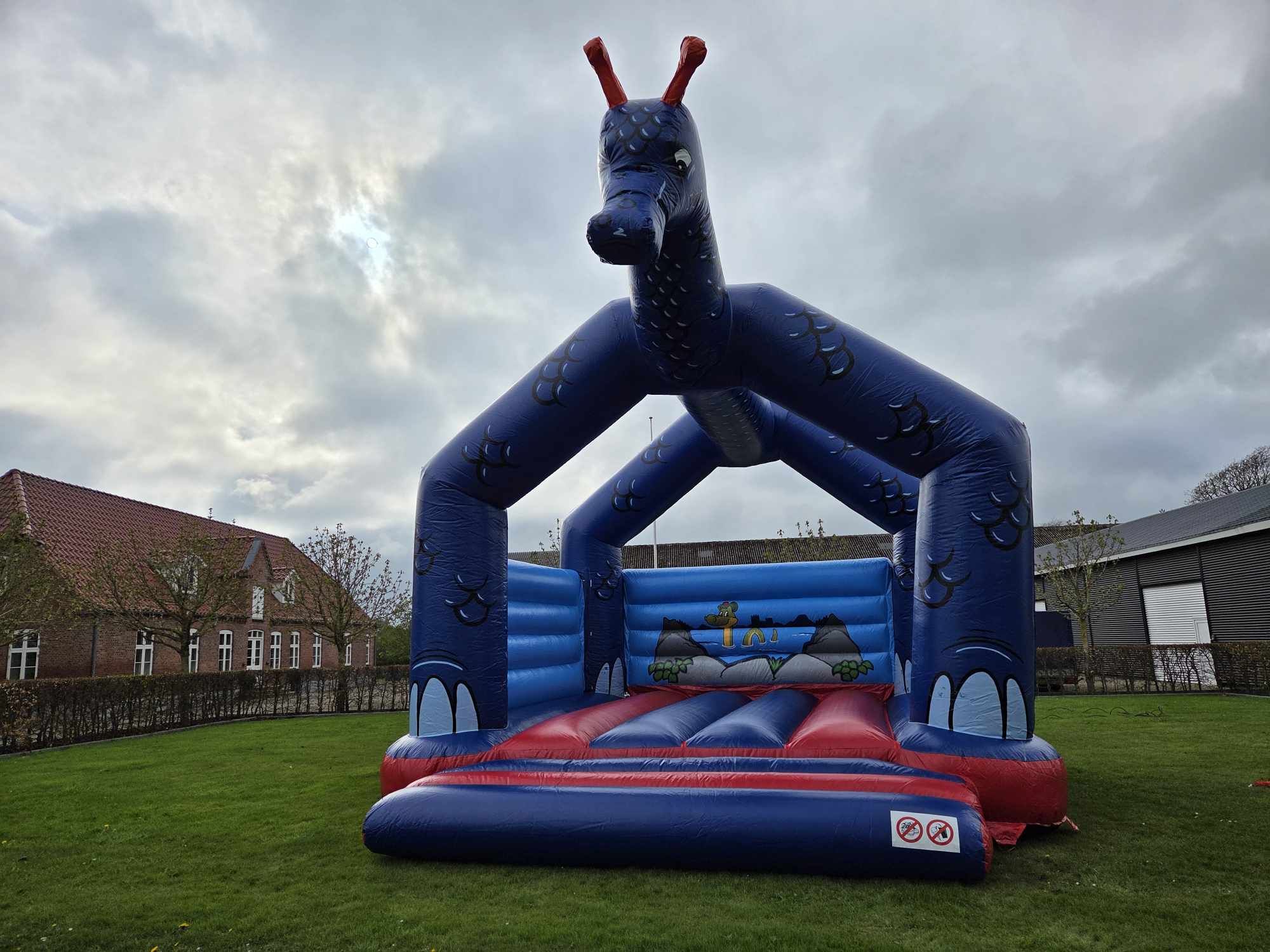 Eight shirts arranged on table in black, olive, grey, blue, white, red, mustard, and green.